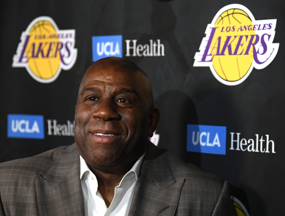 Magic Johnson reacts as he speaks to the press resigning as Los Angeles Lakers President of Basketball Operations before the game against the Portland Trail Blazers at Staples Center on April 09, 2019 in Los Angeles, California. Harry How/AFP 