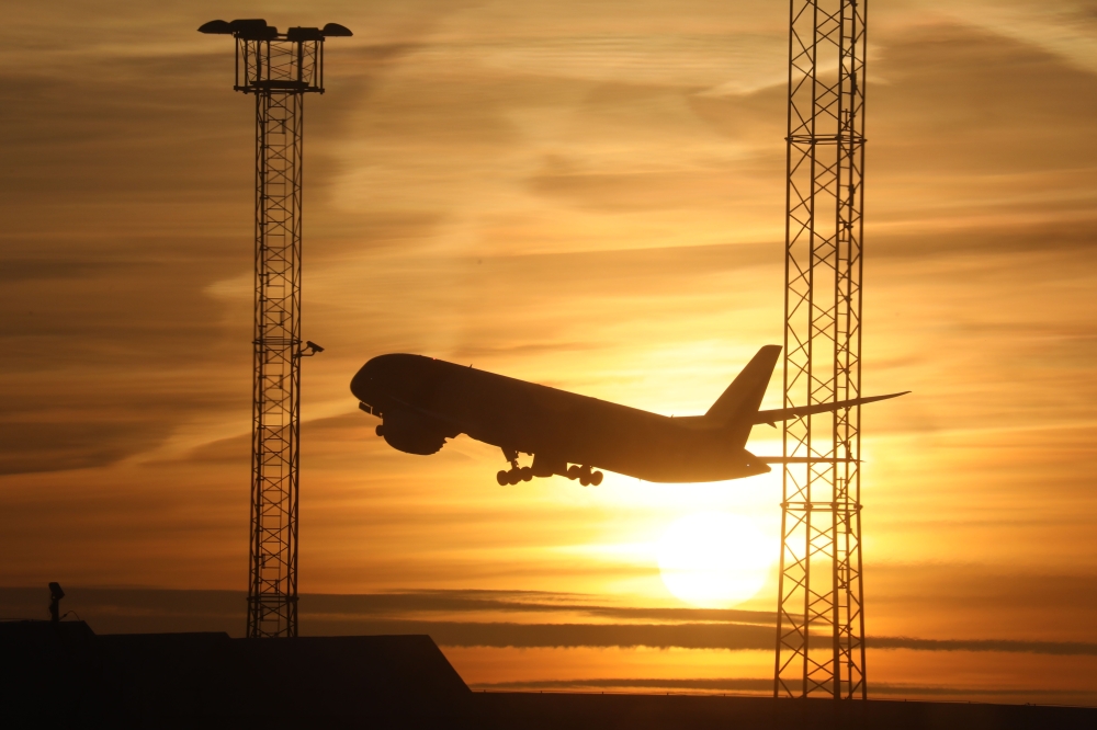 (FILES) In this file photo taken on November 17, 2017 An airplane takes off as the sun sets in Stockholm airport in Sweden. AFP / Ludovic MARIN