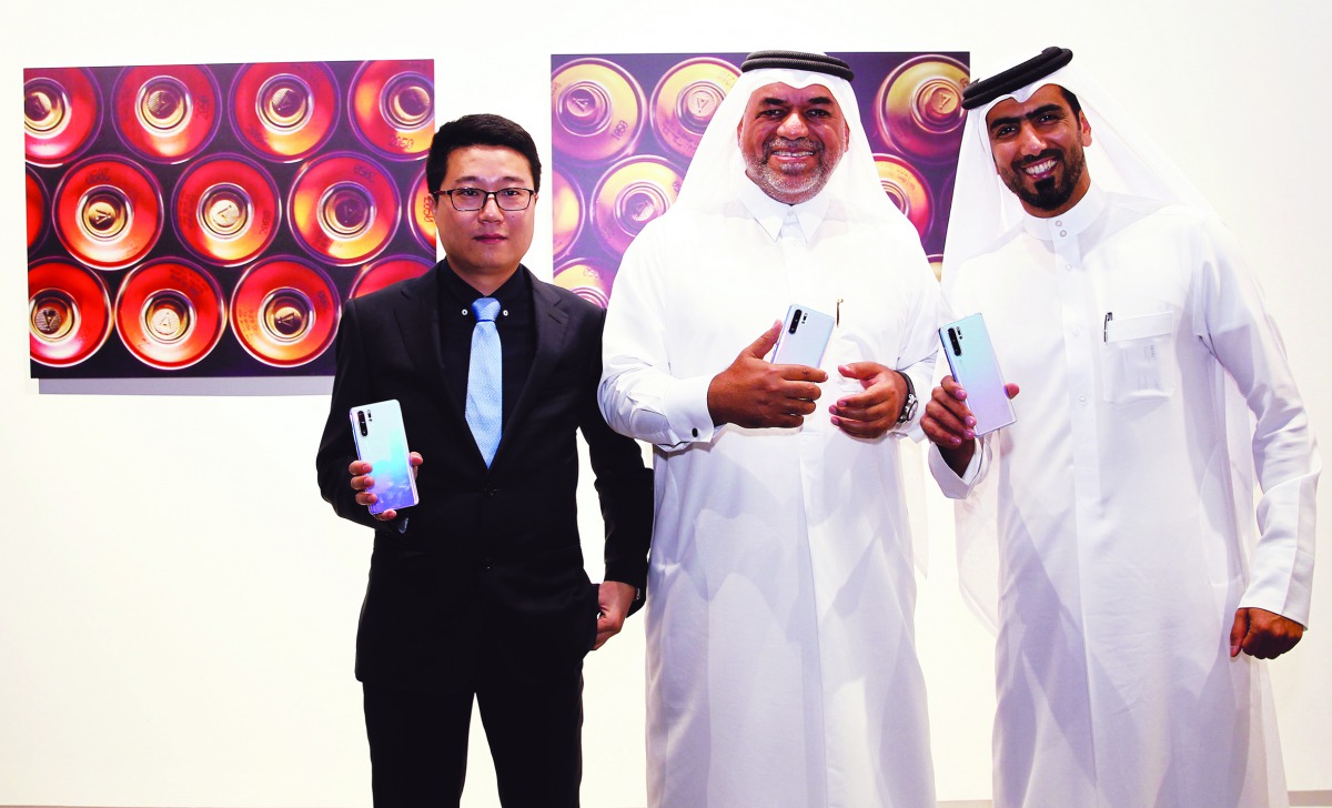 Khalifa Al Obaidly, Director on Fire Station Artist in Residence (centre); and Ian Li, General Manager of Huawei Consumer Business Group, Middle East Multi Countries announce latest art collaboration and open Khalifa Al Obaidly’s photography gallery as pa