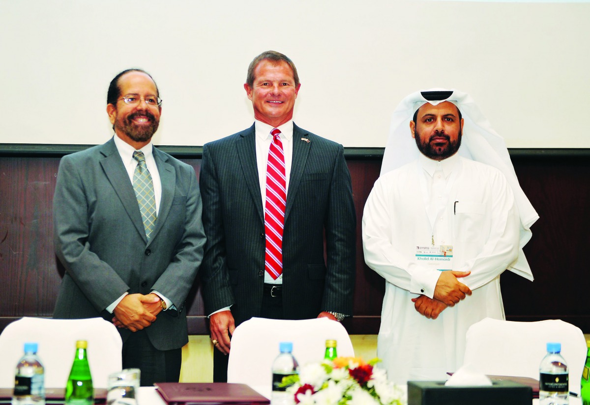 Todd Creeger (centre) President, Conoco Phillips Qatar, with Khalid Al Hemaidi, (right) Chief Operating Officer for Health, Safety, Enviroment & Quality at Qatargas, and Dr. Cesar O Malave, Dean Texas A&M University at Qatar, during the MoU signing ceremo