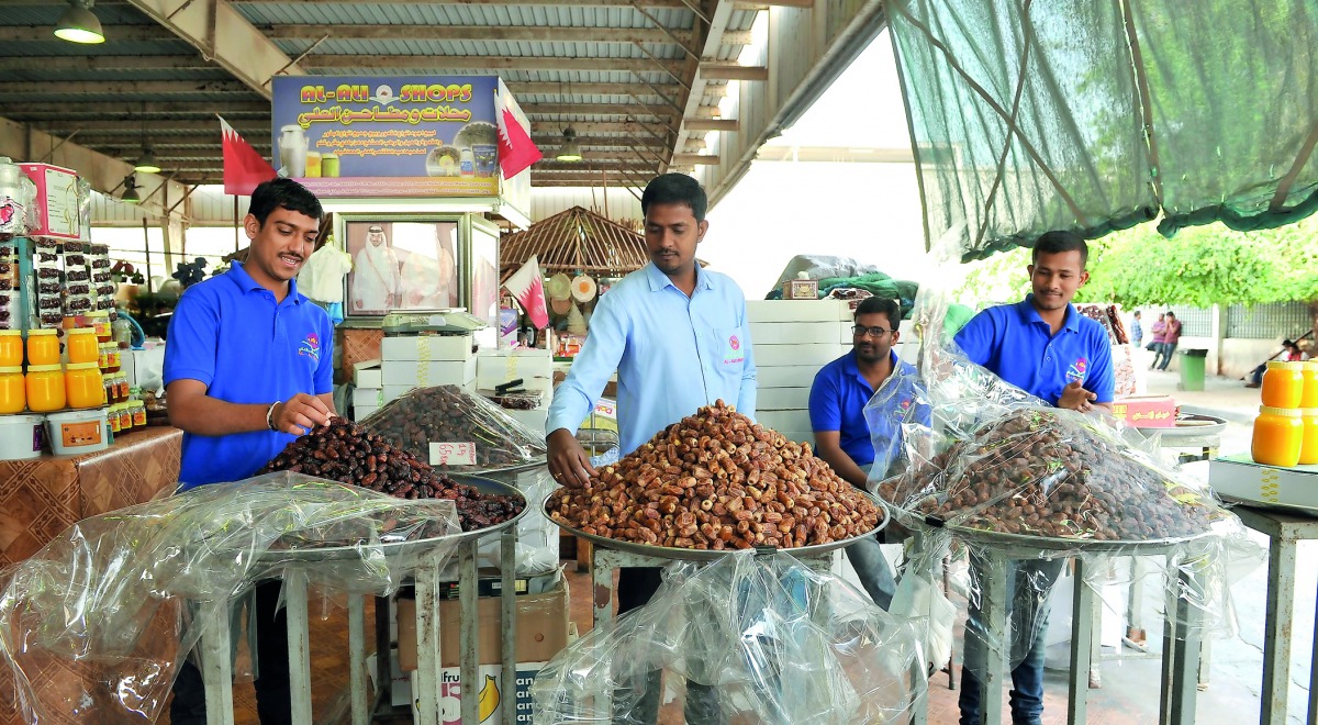 The vendors arranging dates at Omani Market in Abu Hamour, Doha yesterday. Pic: Salim Matramkot/The Peninsula