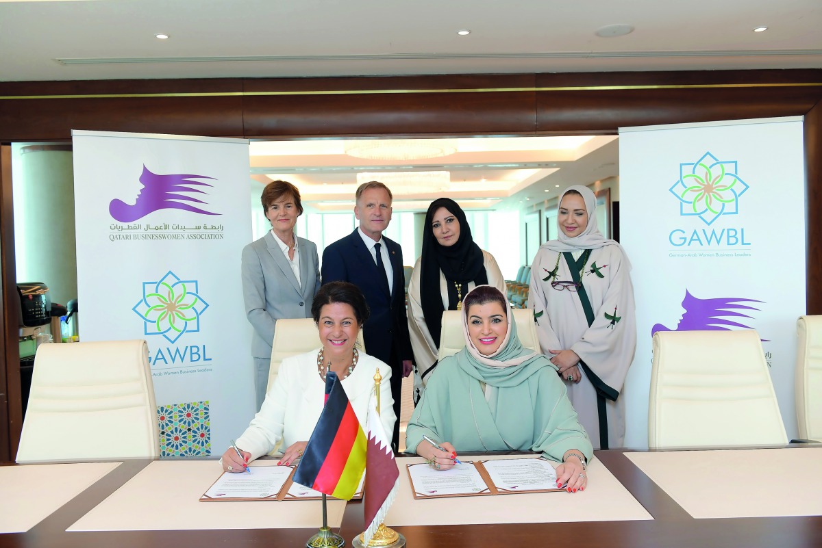 Qatari Businesswomen Association (QBWA) Vice-Chairwoman Aisha Alfardan (sitting right) and German-Arab Women Business Leaders (GAWBL) Chairwoman Dr Gabi Kratochwil (sitting left) at the MoU signing ceremony, yesterday. 