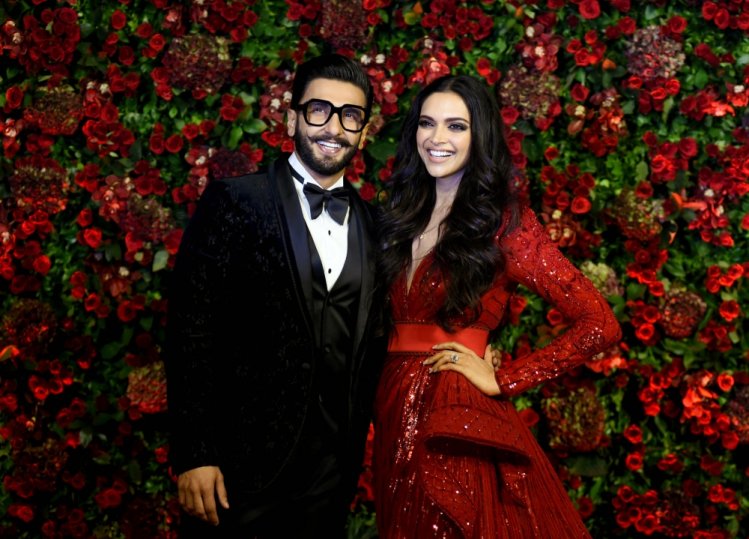 Indian Bollywood actors Ranveer Singh (L) and Deepika Padukone pose for a photograph during their wedding reception party in Mumbai. (AFP/ File Photo)