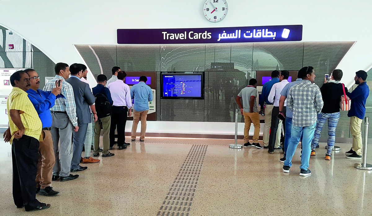 Travellers waiting in line to get their travel cards from travel card vending machine. Pic: Abdul Basit / The Peninsula