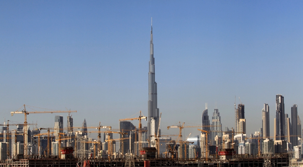 FILE PHOTO: General view of Dubai's cranes at a construction site in Dubai, UAE December 18, 2018. REUTERS/Satish Kumar