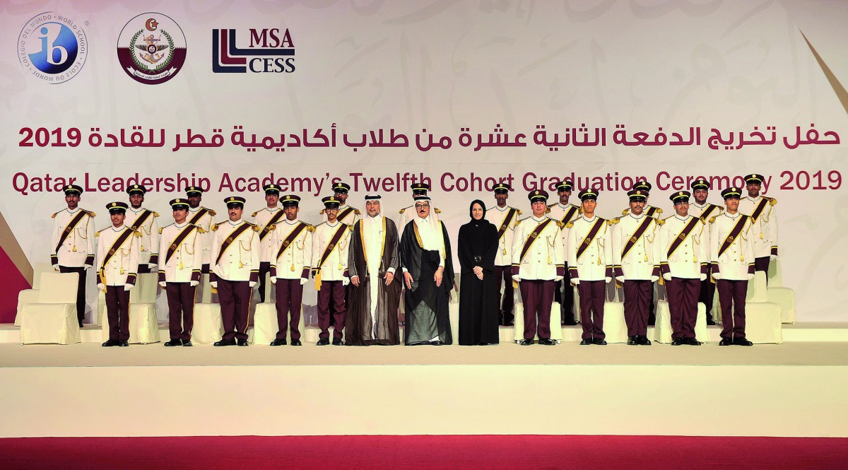 The Minister of State, H E Dr Hamad bin Abdulaziz Al Kuwari; Director of Qatar Leadership Academy (QLA), Staff Brigadier General Ali bin Ahmed Al Kuwari, and President of  QF Pre-University Education, Buthaina A Al Nuaimi, with graduates during the gradua