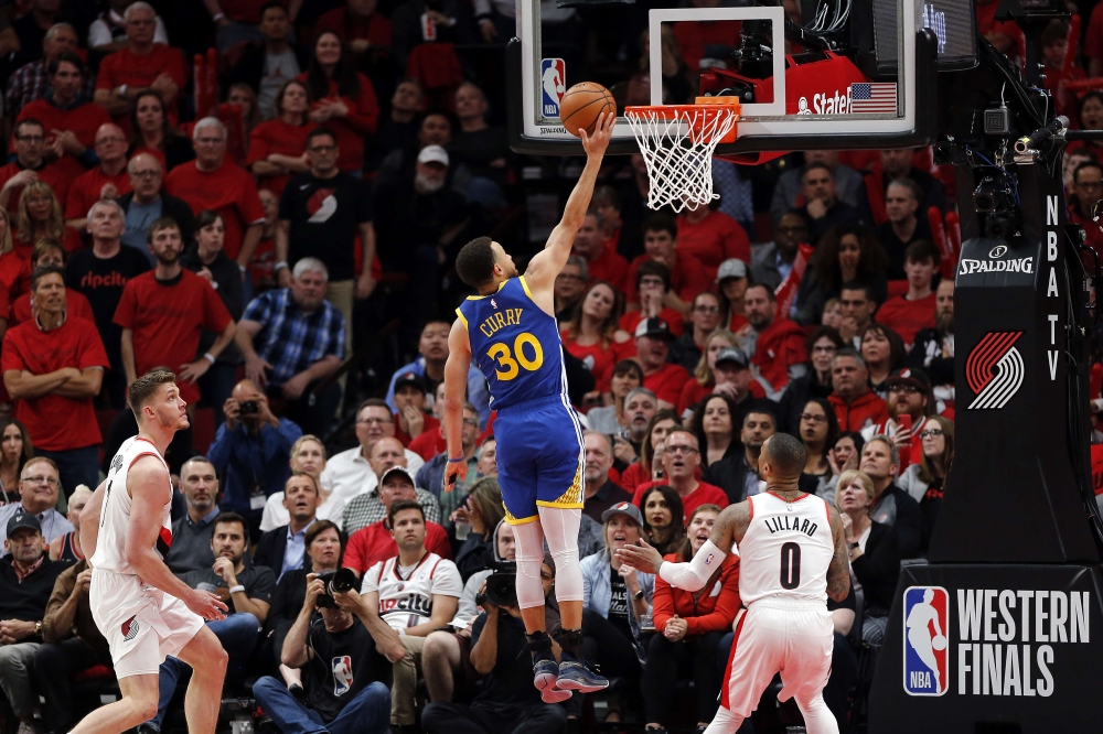 Stephen Curry #30 of the Golden State Warriors shoots the ball during overtime against the Portland Trail Blazers in game four of the NBA Western Conference Finals at Moda Center on May 20, 2019 in Portland, Oregon.  Jonathan Ferrey/AFP