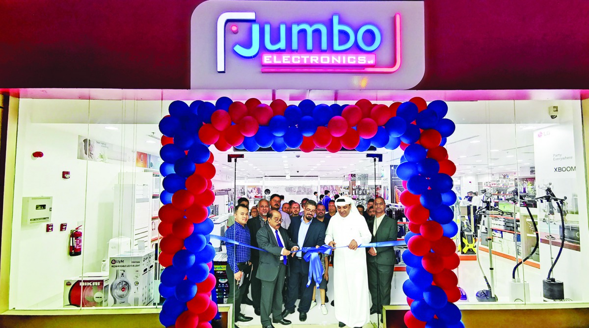 Representatives of Jumbo Electronics cut a ribbon to launch the new showroom at Doha Souq Mall.