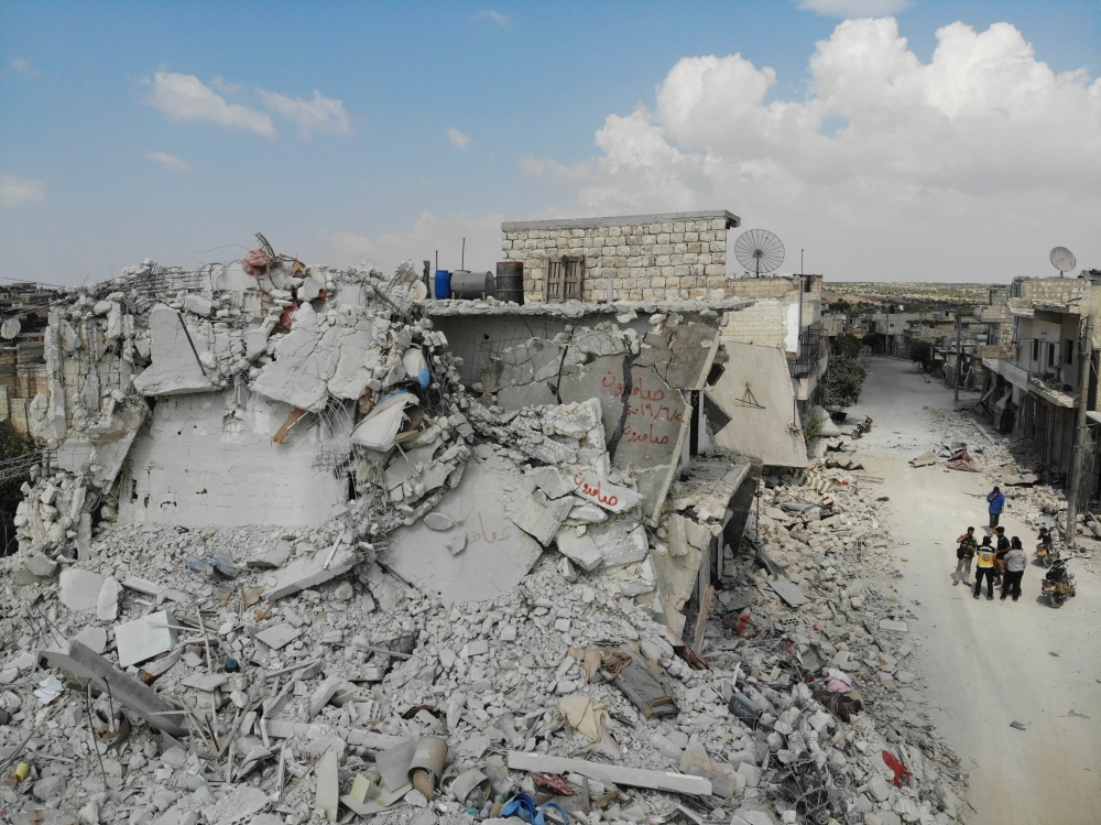 Damaged and destroyed buildings in the town of Ihsim, in Syria’s Idlib region.  AFP / OMAR HAJ KADOUR