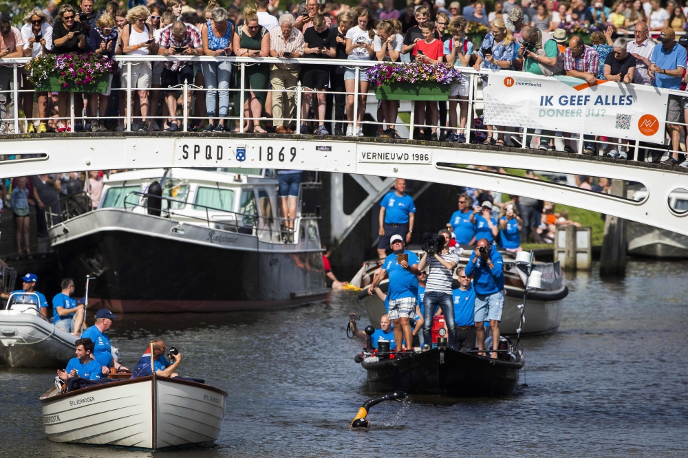 Dutch Former World Champion Maarten van der Weijden is passing Dokkum during his second attempt to swim along the Elfstedentocht, a journey of over 200 kilometers in Leeuwarden, The Netherlands, on June 24, 2019. AFP / ANP / Vincent Jannink 