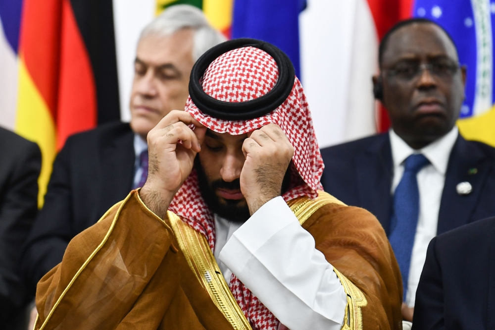 Saudi Arabia's Crown Prince Mohammed bin Salman attends an event on women's empowerment during the G20 Summit in Osaka on June 29, 2019. / AFP / Brendan Smialowski  