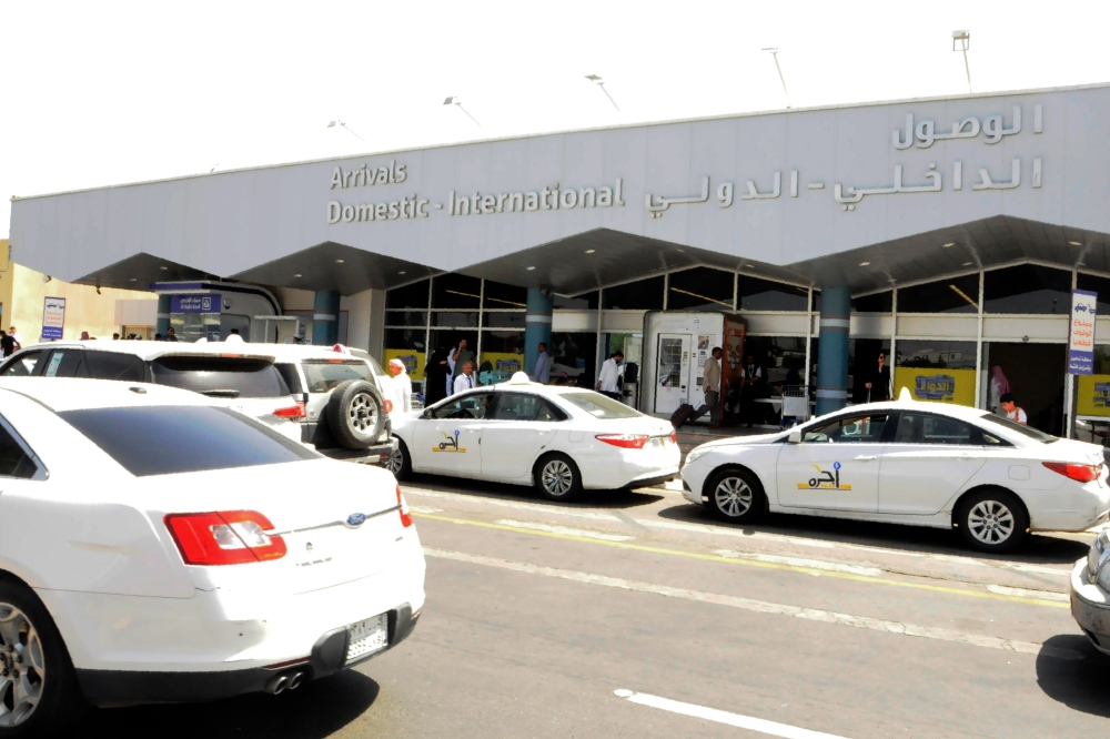 Taxis wait to pick up travellers in front of the arrivals lounge at the Abha airport in the southern Saudi Arabian popular mountain resort of the same name, on June 2, 2019. (AFP)