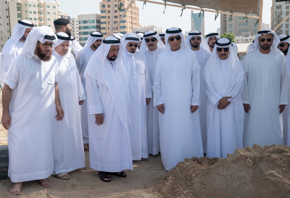 Sheikh Sultan bin Muhammad al-Qasimi (3rd-L), the ruler of the UAE Emirate of Sharjah, attending the burial of his son Khalid, accompanied by the ruler of the Emirate of Ajman Sheikh Humaid bin Rashid Al Nuaimi (4th-L), the ruler of the Emirate of Ras al-