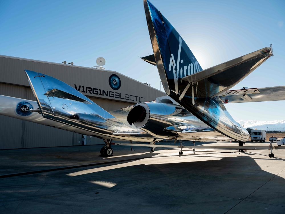 (FILES) In this file photo taken on February 22, 2019 courtesy of Virgin Galactic, SpaceShipTwo mates to the mothership, WhiteKnightTwo, at Mojave Space Port on February 19, 2019, in Mojave, California. AFP PHOTO / Virgin Galactic