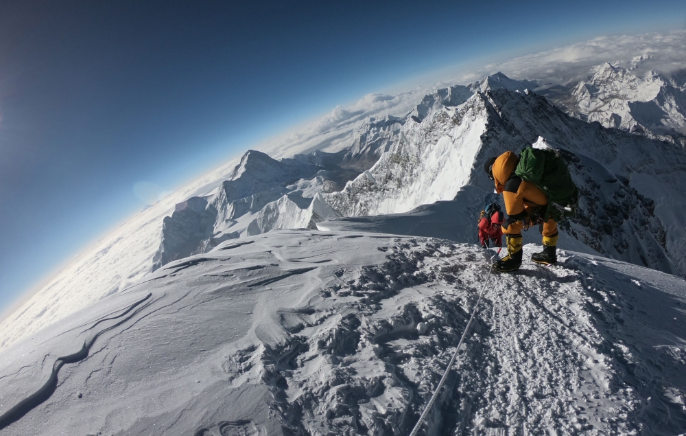 In this file photo taken on May 17, 2018, mountaineers make their way to the summit of Mount Everest as they ascend on the south face from Nepal. AFP/Phunjo Lama