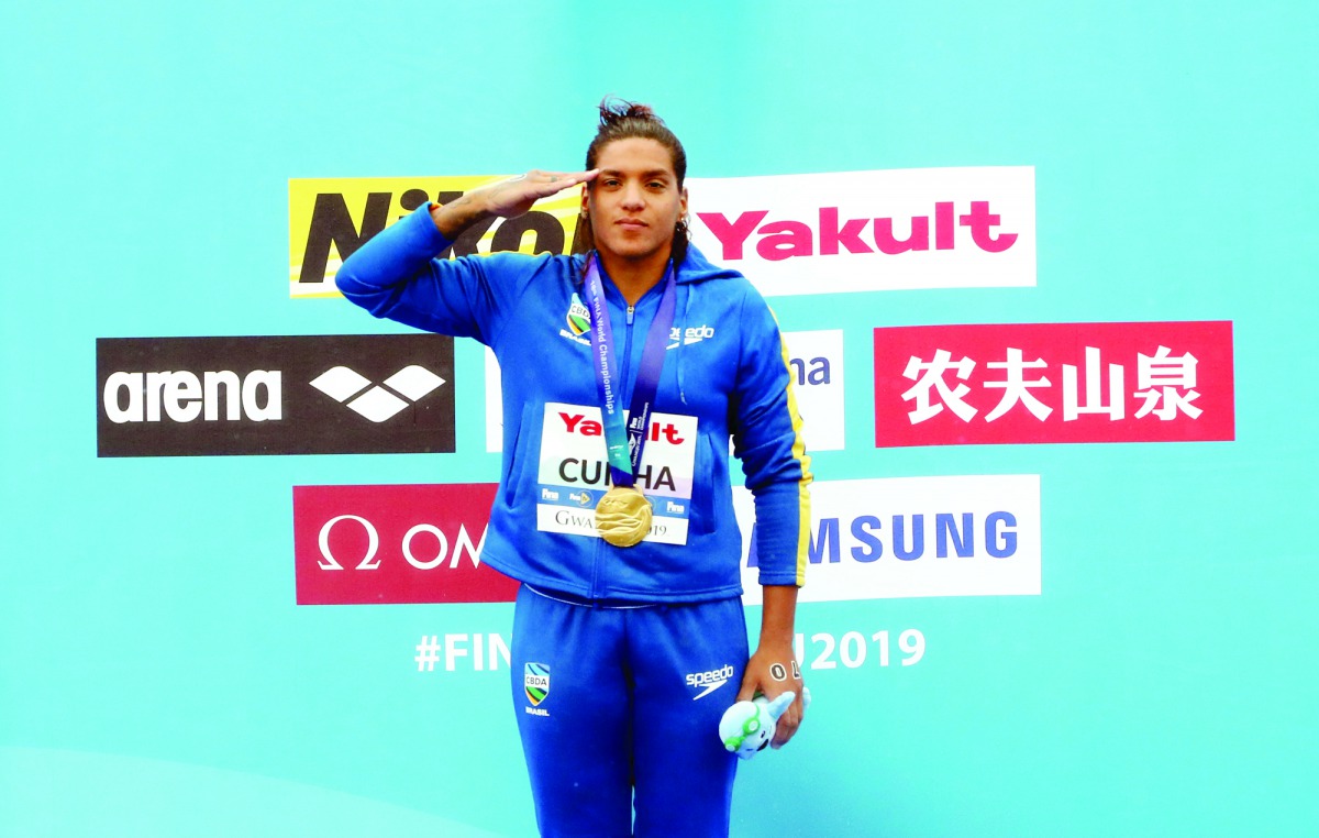 
Gold medallist Ana Marcela Cunha of Brazil salutes on podium. Reuters/Evgenia Novozhenina 