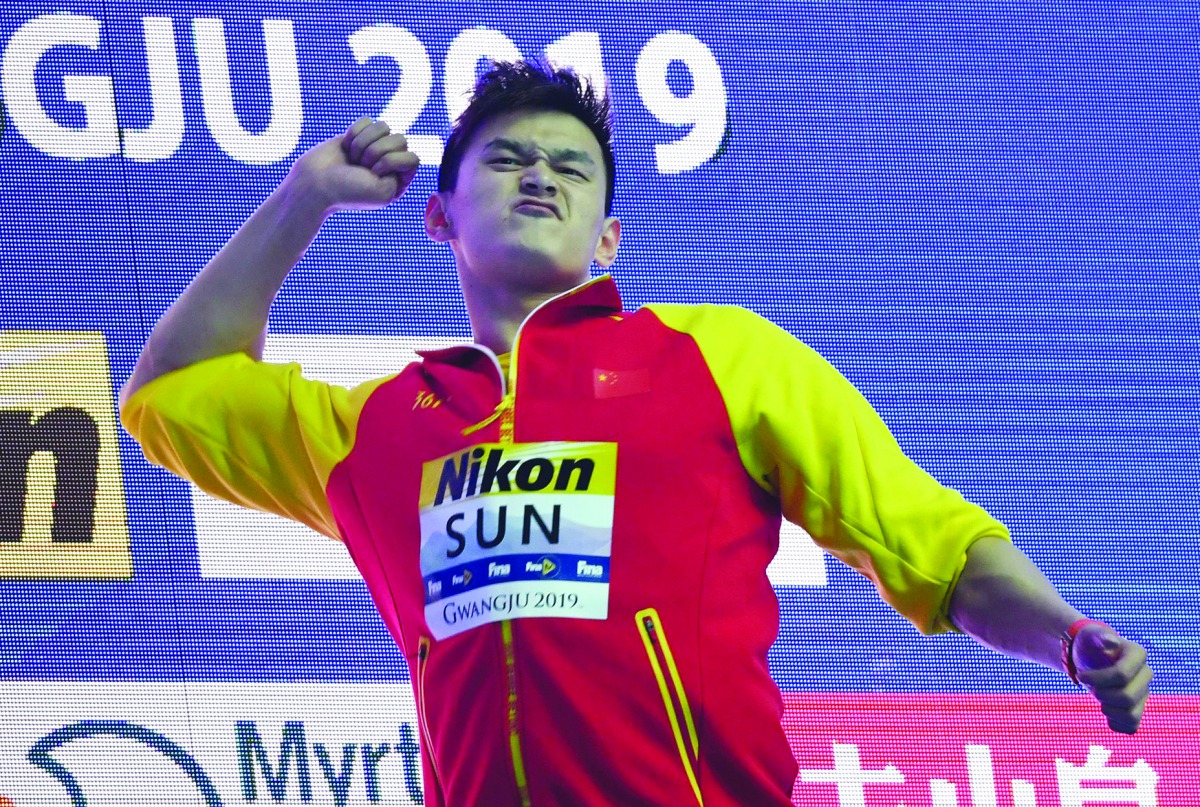 Gold medallist China's Sun Yang poses with his medal after the final of the men's 400m freestyle event during the swimming competition at the 2019 World Championships at Nambu University Municipal Aquatics Center in Gwangju, South Korea, on July 21, 2019.