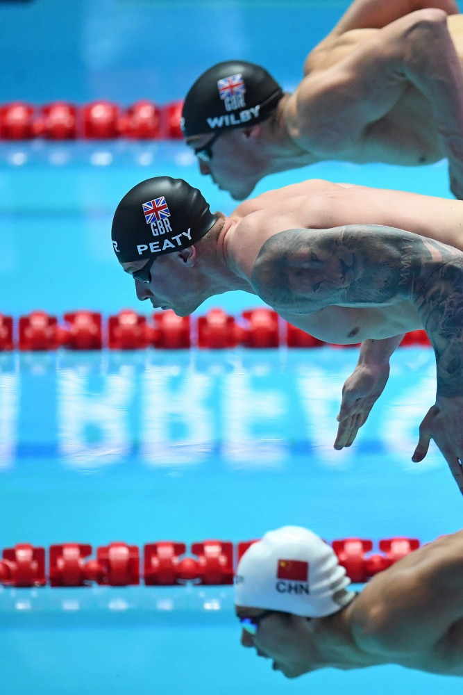 Britain's Adam Peaty competes in the final of the men's 100m breaststroke event during the swimming competition at the 2019 World Championships at Nambu University Municipal Aquatics Center in Gwangju, South Korea, on July 22, 2019. / AFP / Ed Jones