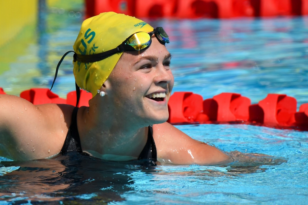 In this file photo taken on April 06, 2018 Australia's Shayna Jack smiles after the women's 50m freestyle qualifications during the 2018 Gold Coast Commonwealth Games at the Optus Aquatic Centre in the Gold Coast.  / AFP / MANAN VATSYAYANA 