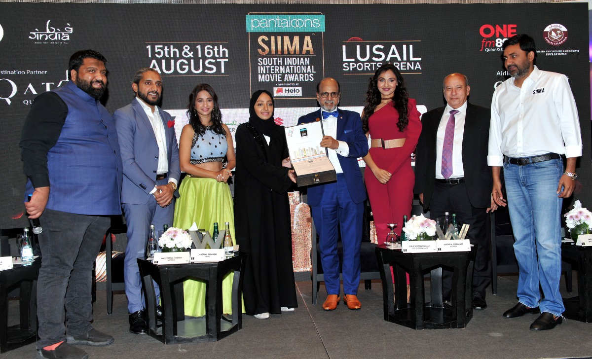 Mashal Shahbik (fourth left), from Qatar National Tourism Council, receiving the VIP Invitation of the 8th South Indian International Movie Awards (SIIMA) from Dr R Seetharaman (sixth left), Group CEO, Doha Bank, after a press conference on SIIMA held at 