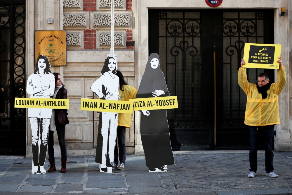 FILE PHOTO: Demonstrators from Amnesty International stage the protest on International Women's day to urge Saudi authorities to release jailed women's rights activists Loujain al-Hathloul, Eman al-Nafjan and Aziza al-Yousef outside the Saudi Arabian Emba