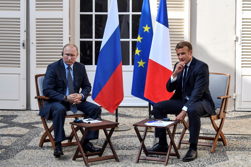 French President Emmanuel Macron meets with Russia's President Vladimir Putin, at his summer retreat of the Bregancon fortress on the Mediterranean coast, near the village of Bormes-les-Mimosas, southern France, on August 19, 2019. Gerard Julien/Pool via 