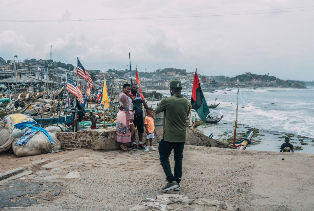 Tourists pose for pictures at the Cape Coast Castle on August 18, 2019. AFP / Natalija Gormalova 