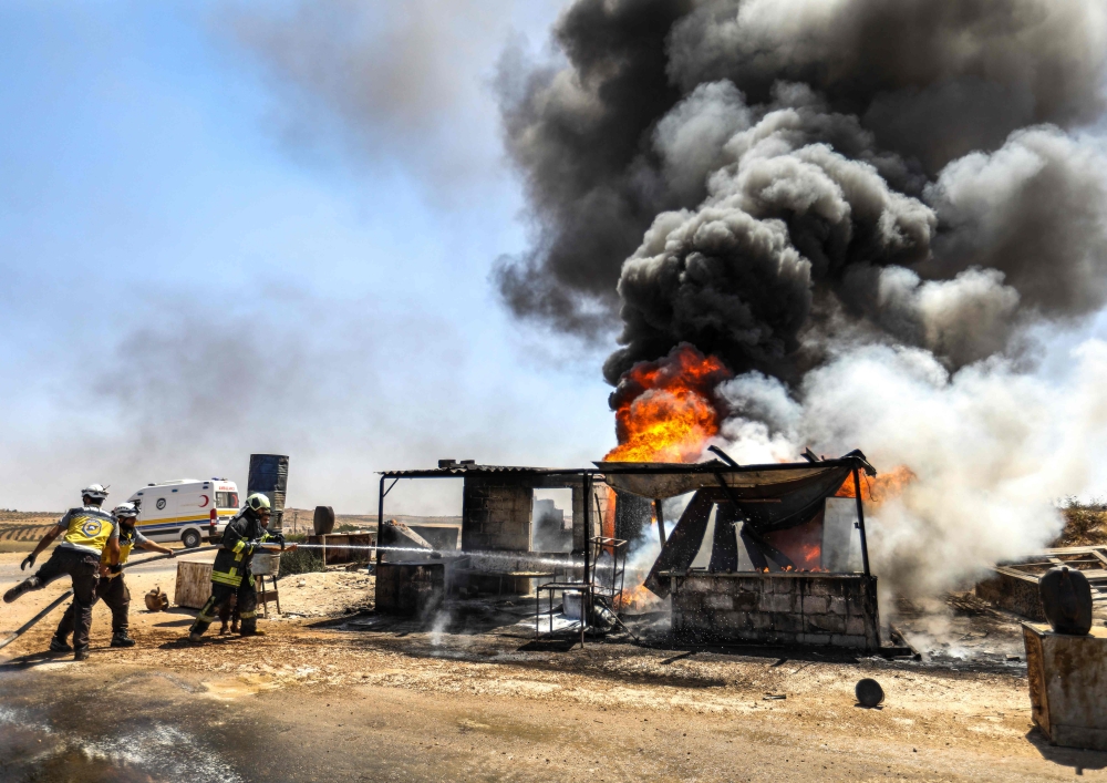 Firefighters from the Syrian Civil Defence, also known as the 