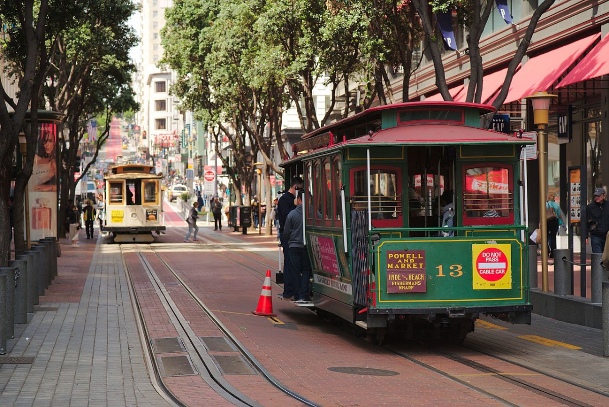 Cable car number thirteen at the Powell Street terminus, San Francisco, with another car in the background cable car system. Photo courtesy: Dllu/Wikimedia Commons/CC BY-SA 4.0