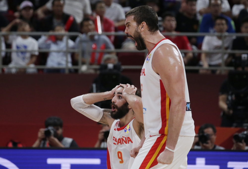 Spain's Marc Gasol and Ricky Rubio react REUTERS/Jason Lee
