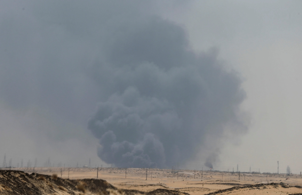 Smoke is seen following a fire at Aramco facility in the eastern city of Abqaiq, Saudi Arabia, September 14, 2019. REUTERS