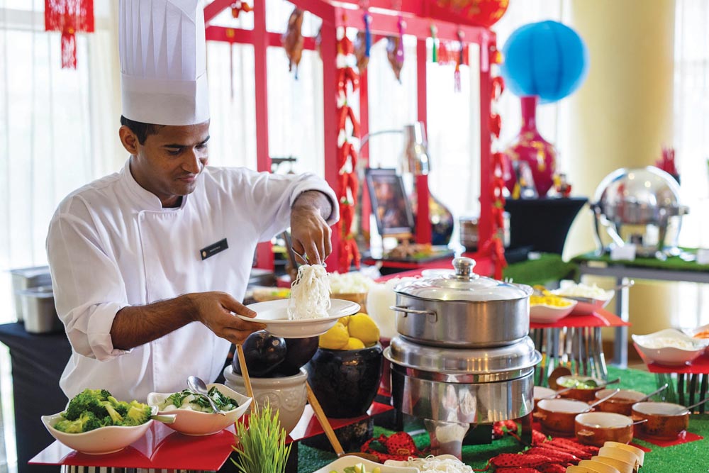 A chef at InterContinental Doha The City during the preparation of a cuisine as it launched a new Friday Brunch at The Square featuring French flavours from around the world