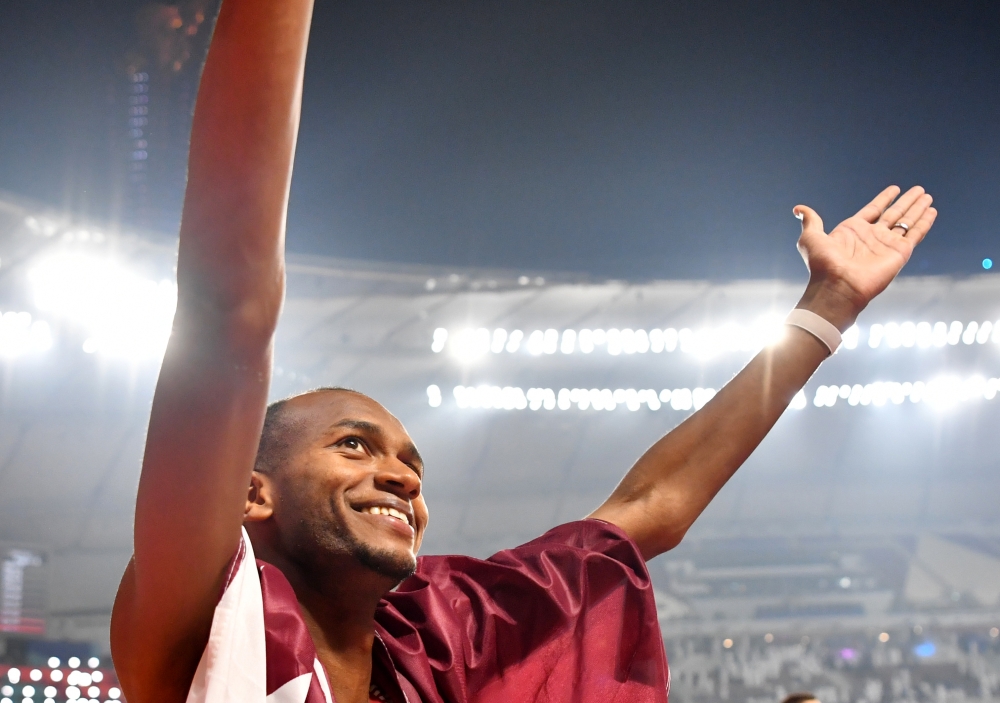  Qatar's Mutaz Essa Barshim celebrates winning gold. Reuters/Dylan Martinez