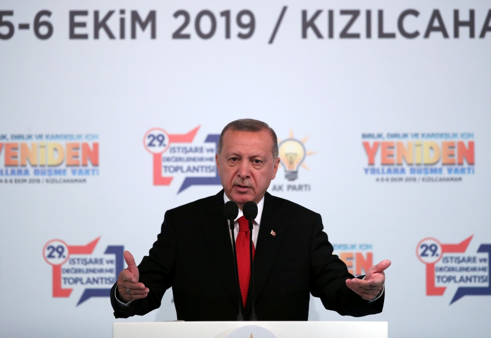 Turkish President Tayyip Erdogan addresses members of his ruling AK Party during a meeting in Ankara, Turkey, October 5, 2019.