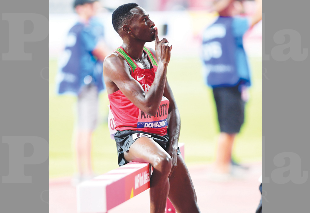 Kenya’s Conseslus Kipruto poses on the hurdle after winning the men’s 3000m steeplechase final on Friday.