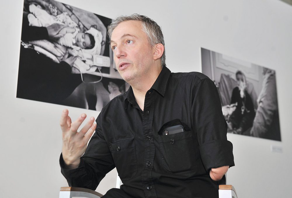 British humanitarian photographer Giles Duley speaks during an interview with The Peninsula on the sidelines of his photo exhibition titled ‘Artistic Dimensions to a Healthier World’ being held at Fire Station, in Doha. Pic: Baher Amin/The Peninsula