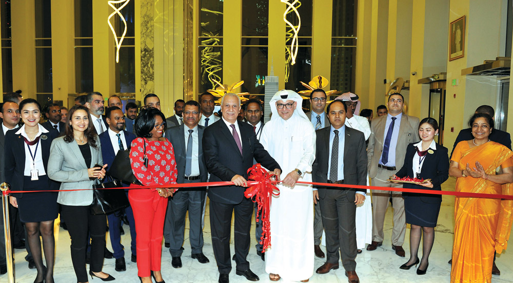 The Chief Executive Officer of Regency Travel and Tours, Tareq Abdullatif Taha, with the Chief Commercial Officer of Qatar Airways, Ehab Amin, inaugurating the new branch of Regency at Al Asmakh Tower, West Bay, on Monday. Pic: Salim Matramkot / The Penin