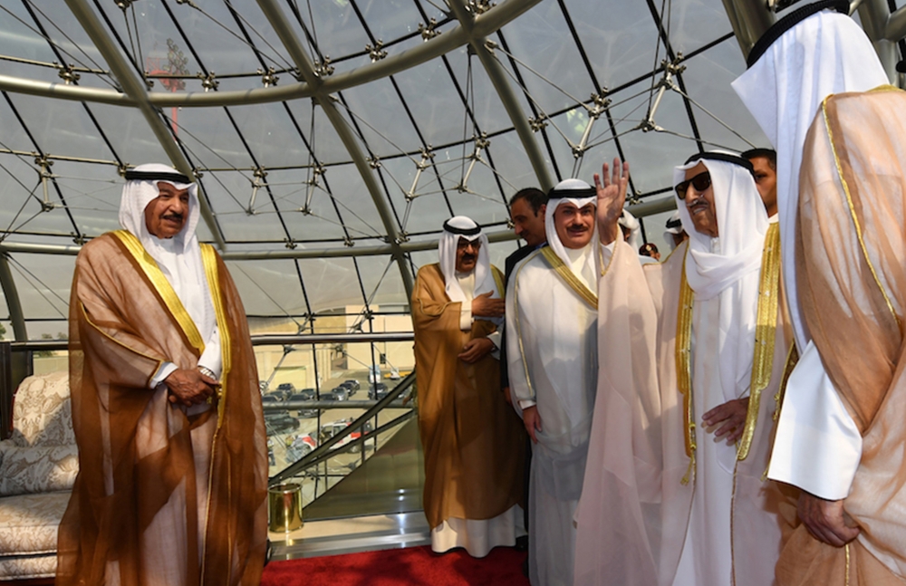 A photo provided by the Kuwaiti news agency KUNA on October 16, 2019 shows the Emir of Kuwait Sheikh Sabah al-Ahmad al-Jaber al-Sabah (R) waving for officials as he arrives at Kuwait international airport. Al-Sabah, returned home today, according to the o