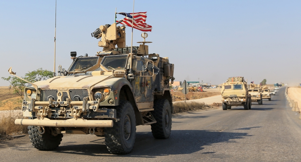 A convoy of U.S. vehicles is seen after withdrawing from northern Syria, on the outskirts of Dohuk, Iraq, October 21, 2019. REUTERS/Ari Jalal