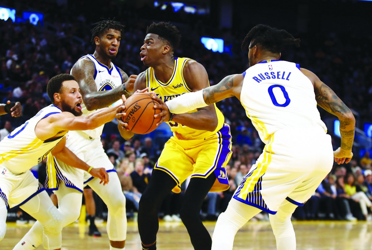  Kostas Antetokounmpo #37 of the Los Angeles Lakers goes up for a shot against Stephen Curry #30, Marquese Chriss #32 and D'Angelo Russell #0 of the Golden State Warriors at Chase Center on October 18, 2019 in San Francisco, California. Ezra Shaw/Getty Im