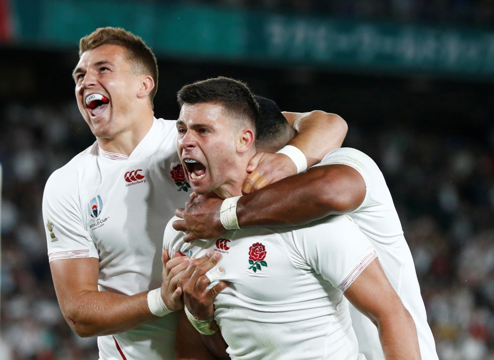 England's Ben Youngs celebrates scoring a try with teammates that is later disallowed after a TMO review. REUTERS/Edgar Su