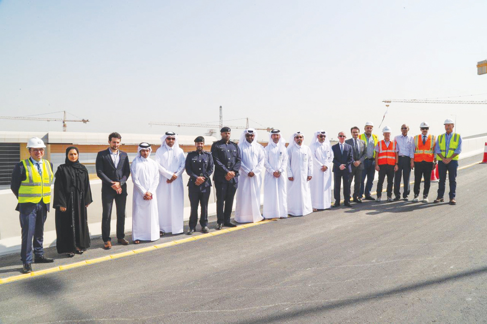 Ashghal officials with guests during the tour of the new bridge at Landmark Interchange yesterday.