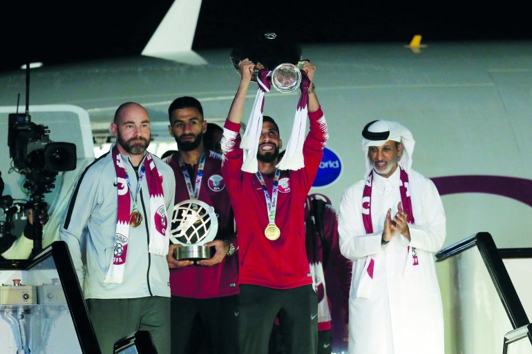 Qatari captain Hassan Al Haydos, coach Feliz Sanchez, QFA President Sheikh Hamad bin Khalifa bin Ahmed Al Thani and goalkeeper Saad Al Sheeb at Doha International Airport, upon their return from Abu Dhabi after winning maiden AFC Asian Cup in this Februar