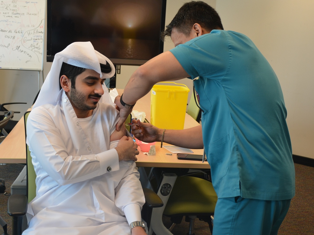 File picture of a person being administered flu vaccine. 