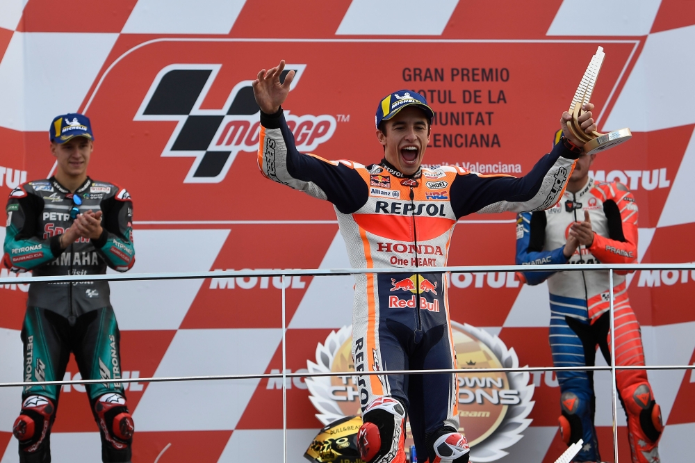 Repsol Honda Team's Spanish rider Marc Marquez celebrates with the trophy on the podium after winning the MotoGP race of the MotoGP Valencia Grand Prix at the Ricardo Tormo racetrack in Cheste near Valencia, on November 17, 2019.   AFP / PIERRE-PHILIPPE M