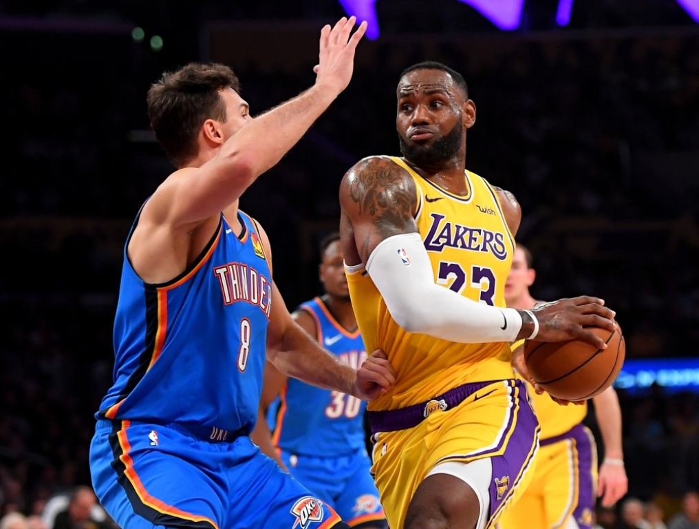 Nov 19, 2019; Los Angeles, CA, USA; Oklahoma City Thunder forward Danilo Gallinari (8) guards Los Angeles Lakers forward LeBron James (23) as he drives to the basket in the second half of the game at Staples Center. Mandatory Credit: Jayne Kamin-Oncea-USA