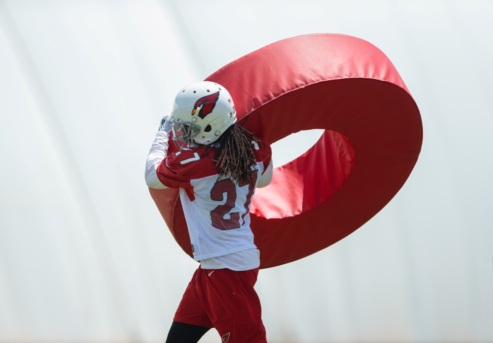 Jun 11, 2019; Tempe, AZ, USA; Arizona Cardinals defensive back Josh Shaw (27) does tackling drills with a roll tackle ring during minicamp at the teams Tempe training facility. Mark J. Rebilas-USA TODAY Sports/File Photo
 