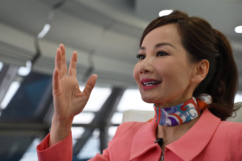 (FILES) In this file photo taken on April 26, 2019 Travel services company CEO of Trip.com Jane Jie Sun Jie speaks during an interview with AFP in the facilities of Ctrip in Shanghai. AFP / Hector Retamal 