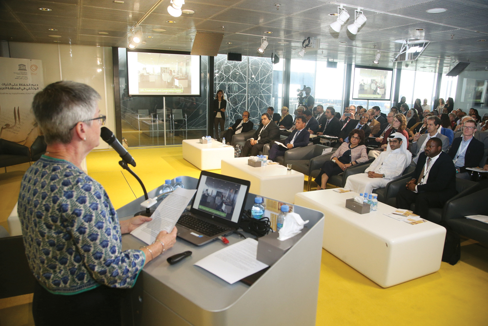 An expert speaking at the conference at Qatar National Library.