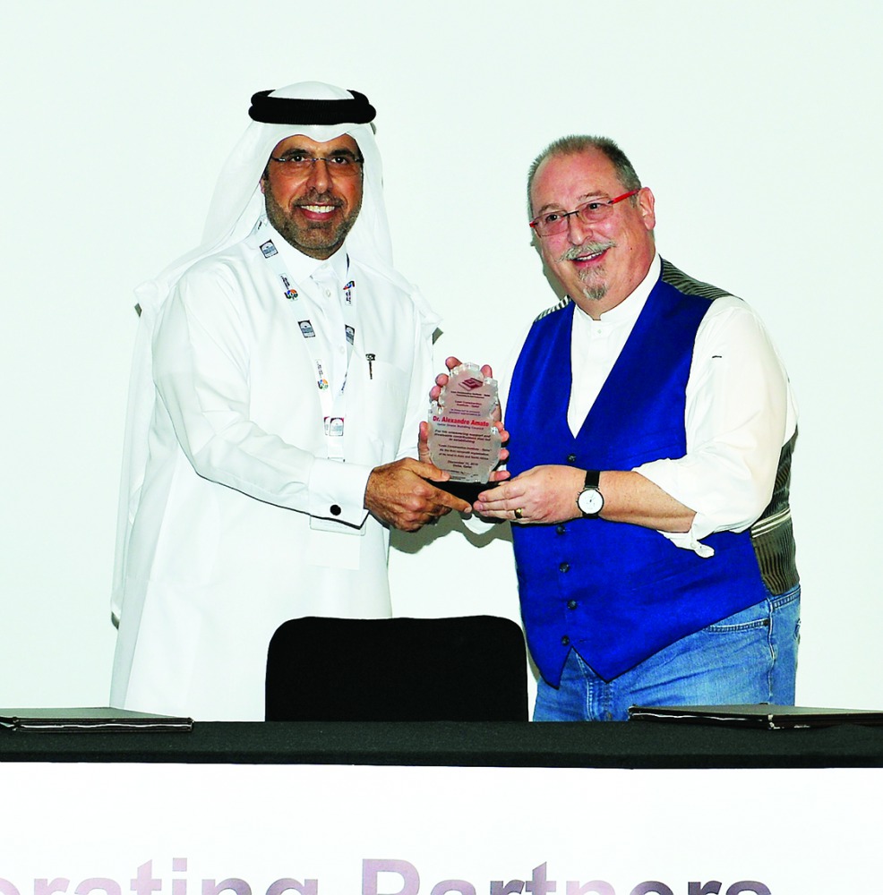 Dr Abdulla Yaqoub Al Sayed (left), presenting a memento to Dr Alex Amato during the launch of LCI-Q at W Doha recently. Pic: Salim Matramkot/The Peninsula